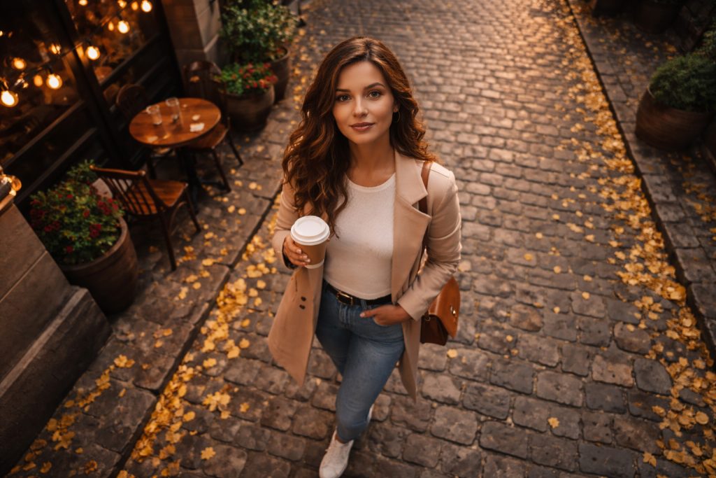 a woman is walking and picture is taken high angle shot