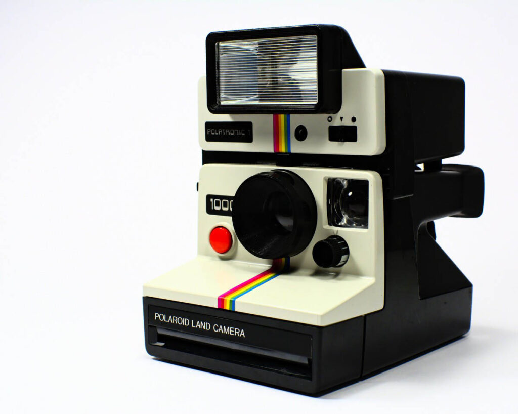 Polaroid camera with flashlight