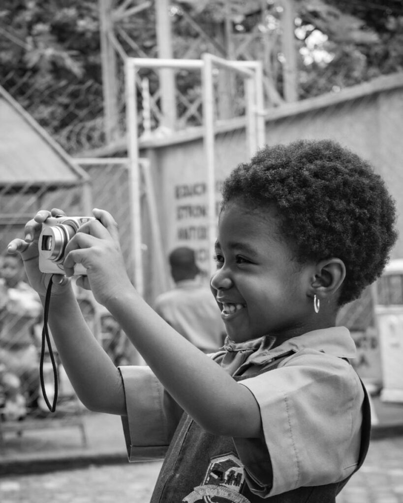 small-child-taking-photos-with-compact-camera