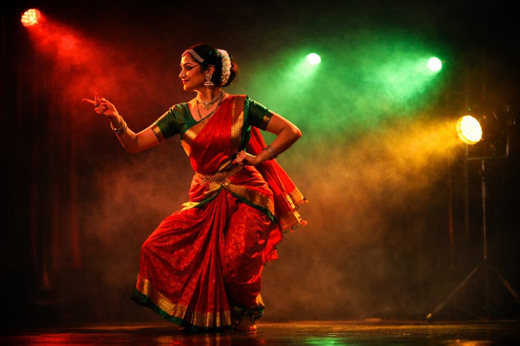 a dancer is dancing on stage with different colors led lights