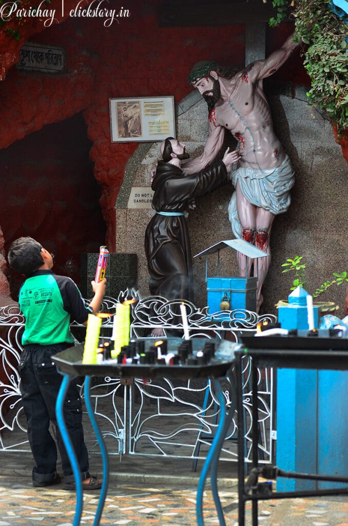 crucification model watching a boy in bandel church